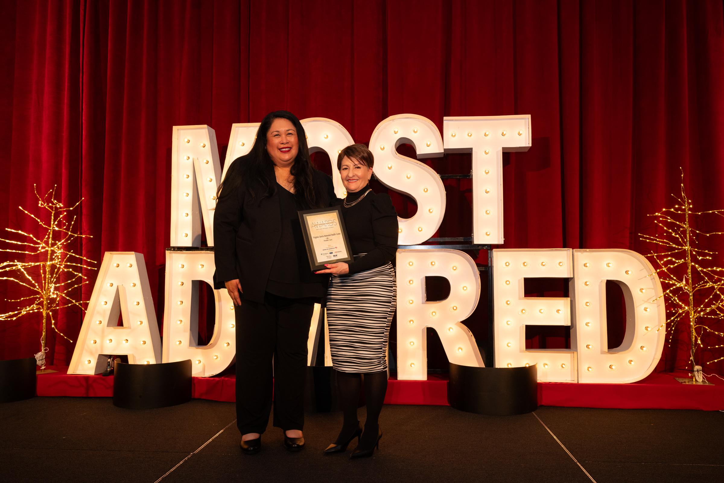person holding plaque