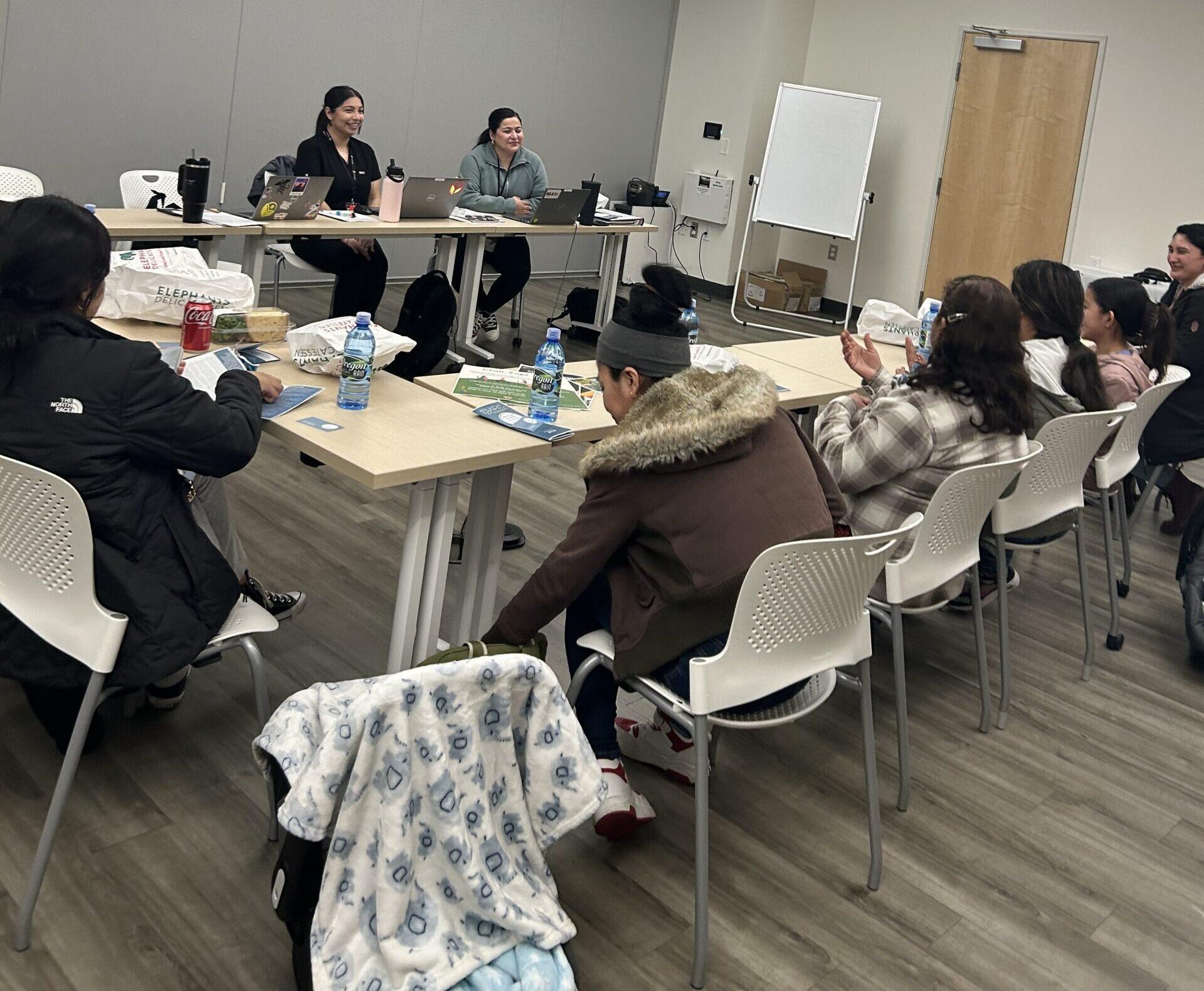 Group of people sitting around a conference table