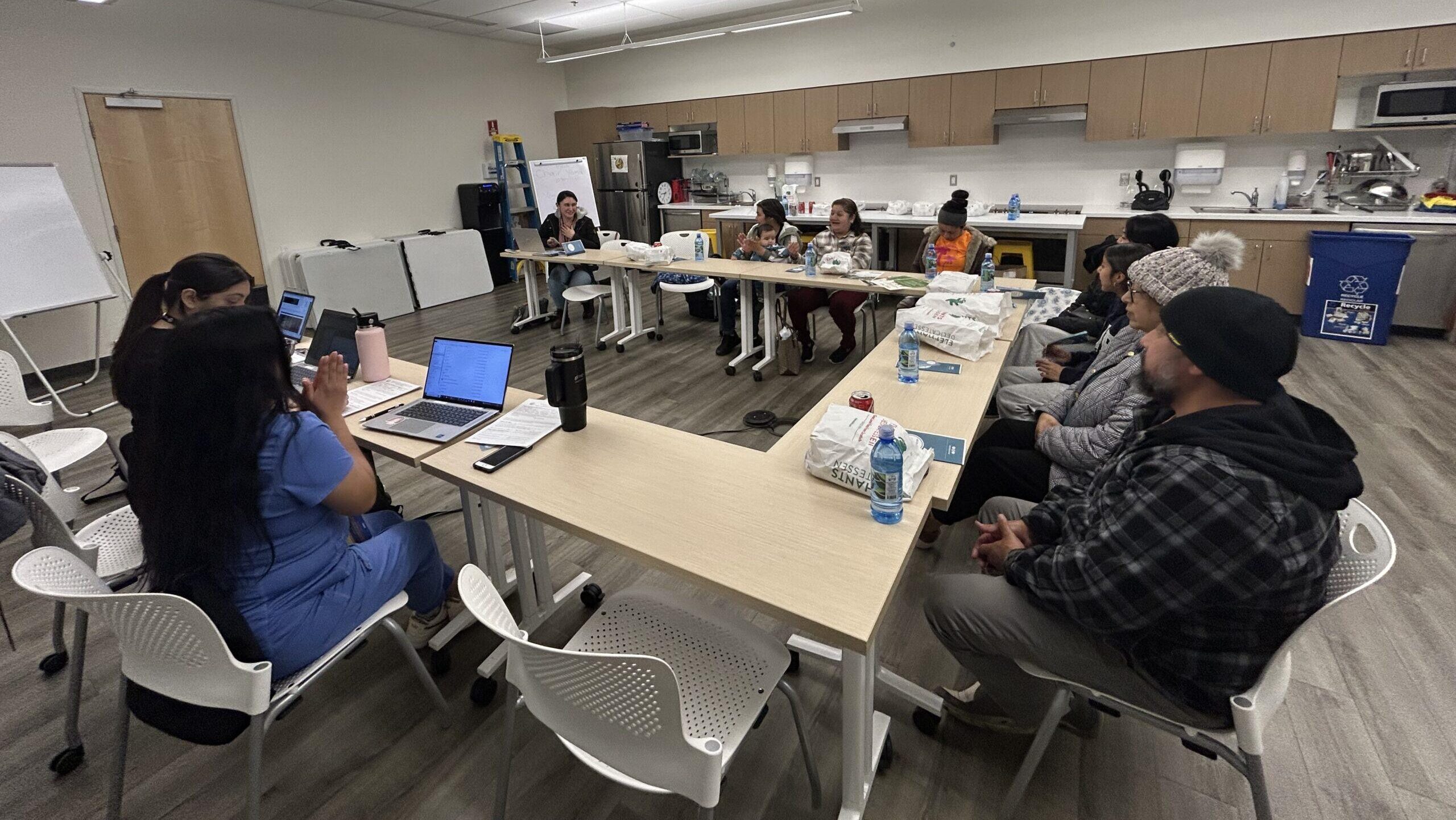 Group of people sitting around a conference table