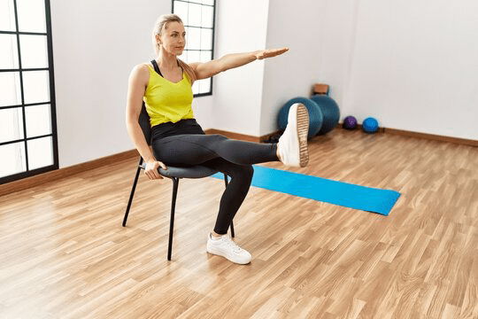 Young blonde girl smiling happy training at sport center.