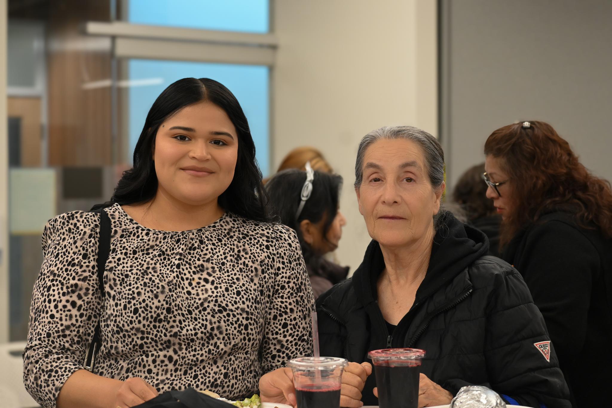 Two patients smiling at the camera