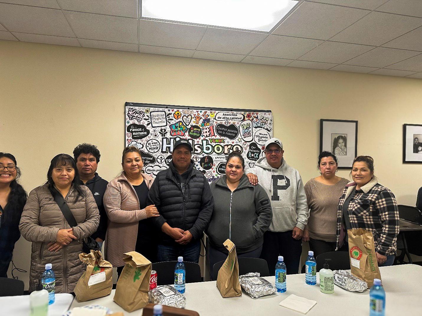 Group of individuals standing smiling on the Patient Advisory Council